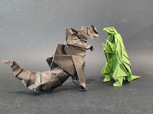 Origami versions of Godzilla and Gamera facing each others