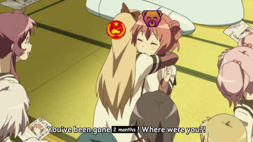 Screencap from anime YuruYuri season 2 episode 11, showing Kyouko hugging Akari tightly, surrounded by their other friends; a time machine is visible in the background and several missing posters with Akari's face are strewn over the floor. Kyouko's head has the Lemmygrad logo on it and Akari's has the Hexbear logo; the subtitle reads, "You've been gone 2 months! Where were you?!"
