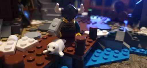 A viking about to club a baby seal