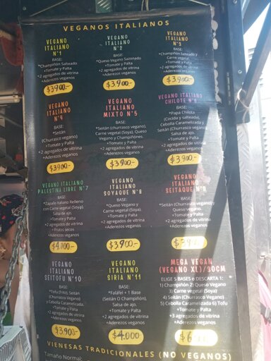 Fotografía de pendón con el listado de completos, precio e ingrediendientes de cada completo