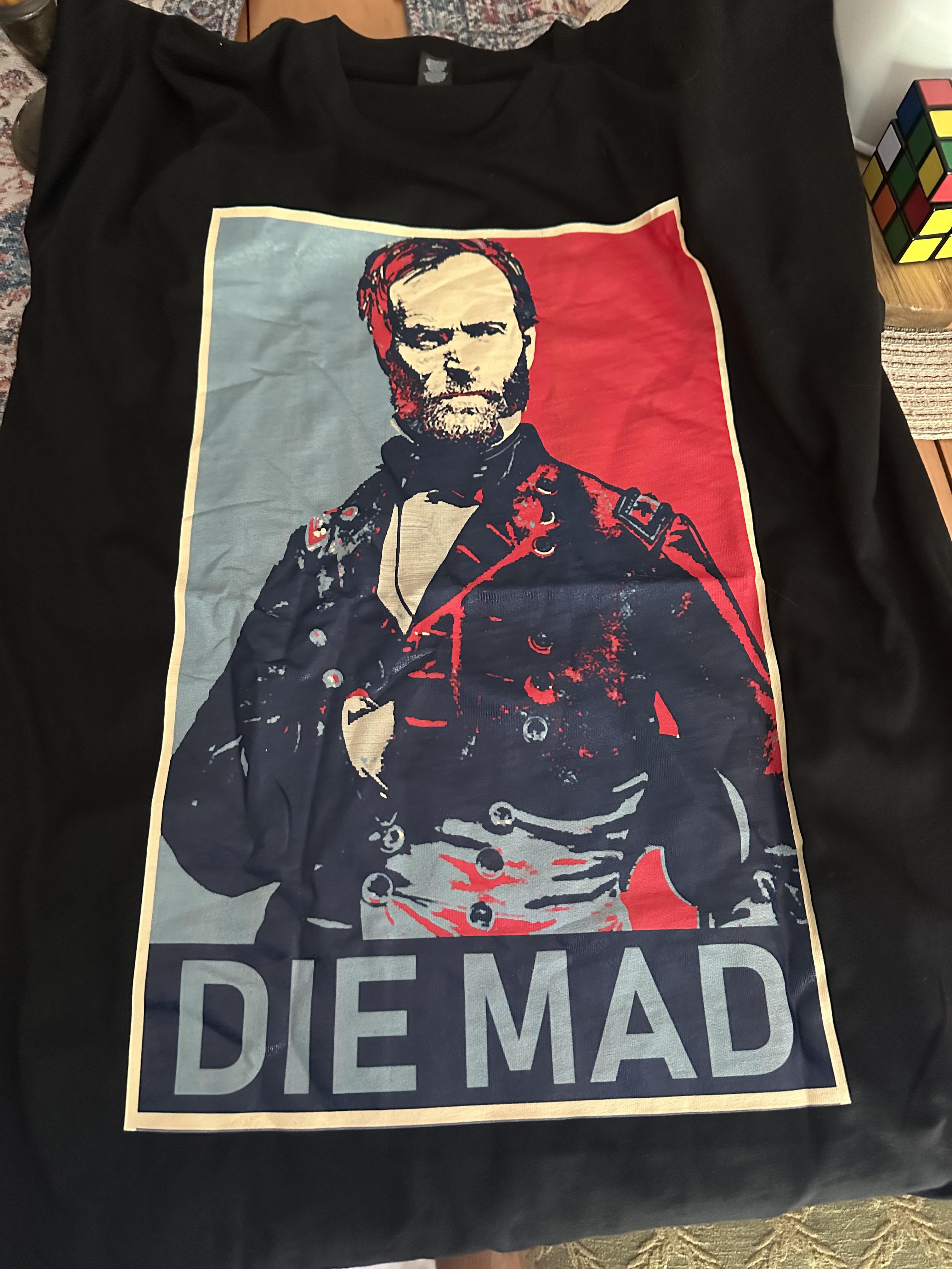 A picture of a shirt depicting General William Sherman with the caption “DIE MAD” underneath