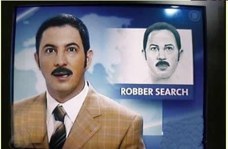 a tv news guy does a report about a robbery suspect. a police sketch of the suspect is displayed in the corner of the shot.  the sketch looks nearly identical to the news guy.